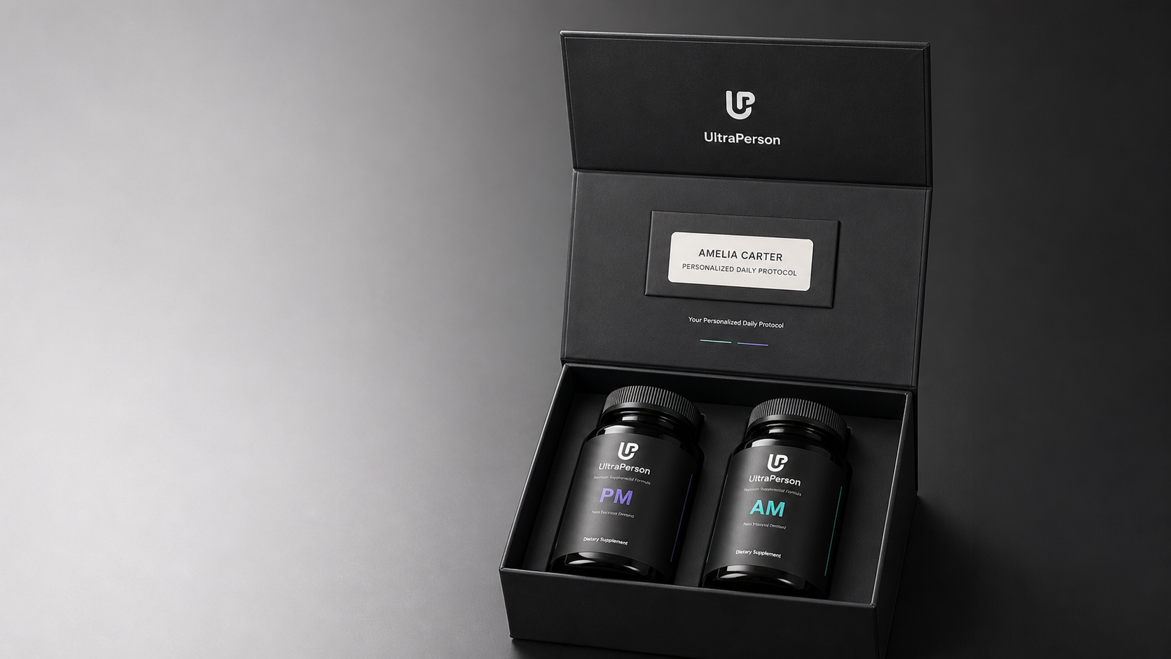An open matte-black UltraPerson kit showing a named patient card reading Amelia Carter and two supplement bottles labeled AM and PM.